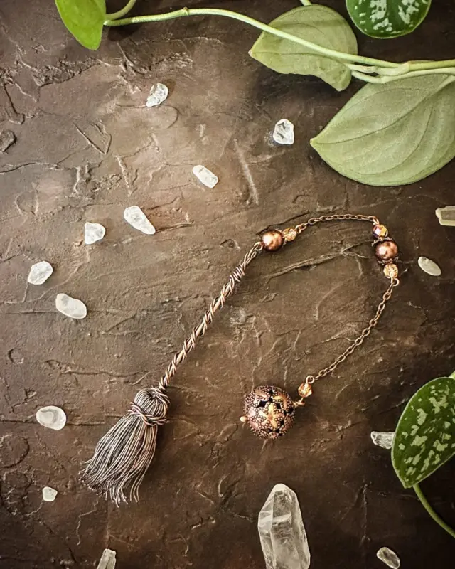 Embrace the magick of divination with this Copper Wire Witch Broomstick Pendulum, a unique tool for spiritual guidance and energy work. 

Crafted with intention, this artisan pendulum combines the symbolic power of the witch's broomstick with crystal accents, creating a one-of-a-kind divination tool. This pendulum is ritually cleansed and magickally blessed, making it a perfect divination tool for dowsing, energy work, and setting intentions. It also makes a wonderful gift for witches and spiritual practitioners, Reiki healers and energy workers,  divination enthusiasts,  Anyone celebrating new beginnings or spiritual milestones.

How It Can Be Used:
 
✨ Divination and dowsing
 
✨ Clearing blocked energy 

✨ Reiki and energy healing
 
✨ Space clearing and intention setting 

This and many other magickal creations are available in the shop, link in bio. 

https://herenchantedcreations.com/follow-hec/

#herenchantedcreations #magicalcreations #makingmagic #makeeverydaymagic #magicaltools #divinationtools #ritualtools #everydaywitchcraft #everydaymagic #witchylife