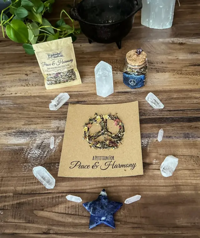 Let serenity fill your space and spirit. The Peace & Harmony blend is a gentle balm for the soul, crafted to restore balance and invite peaceful, high-vibrational energy into your rituals and daily life.

Made with amethyst and a peace sign charm, this nurturing blend supports emotional well-being, restful sleep, and spiritual renewal. Burn during meditation or with the Inner Peace & Power spell candleholder for calming rituals.

Magickal Properties
✨Encourages Serenity & Stress Relief – Promotes relaxation and emotional healing.
✨Clears Negative Energy & Restores Balance – Supports a harmonious atmosphere.
✨Enhances Meditation & Spiritual Renewal – Deepens focus and invites peaceful energy.

It includes a carefully selected combination of botanicals, resins, and essential oils known to cleanse, uplift, and restore harmony:

🌿Lavender – Promotes relaxation, stress relief, and spiritual cleansing.
🌿Sage – Clears negativity and invites peaceful energy.
🌿Vervain – Aids in emotional healing and personal empowerment.
🌿Frankincense – Encourages deep breathing, grounding, and inner peace.
🌿Wormwood – Supports emotional release, easing tension and promoting tranquility.

Many of these botanicals are grown in my own garden and harvested under optimal lunar and planetary alignments for maximum potency.

This and many other magickal items available in the shop, link in bio 🤍

#herenchantedcreations #herbalblend #magicalcreations #magicalsolutions #makingmagic #makeeverydaymagic #magicaltools #ritualtools #witchylife #everydaywitchcraft #everydaymagic